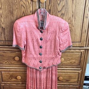 Double D Ranch Coral Fabric with Label

Brocade type material.